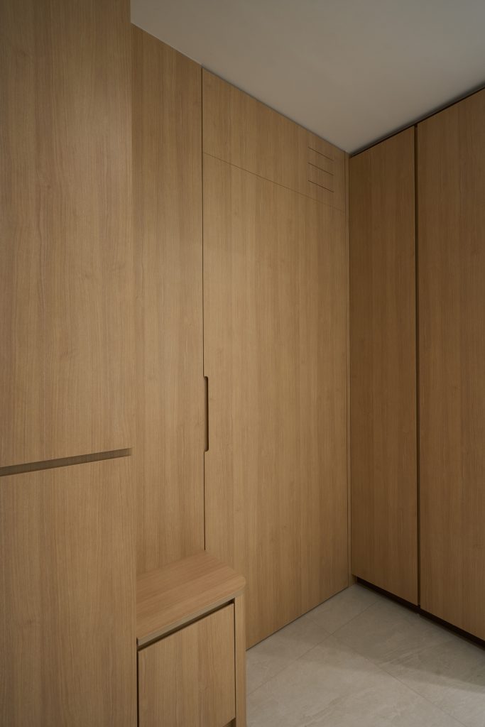 Condo renovation at 45 Canberra Drive Singapore with light oak carpentry and sage green walls by Interior Diary