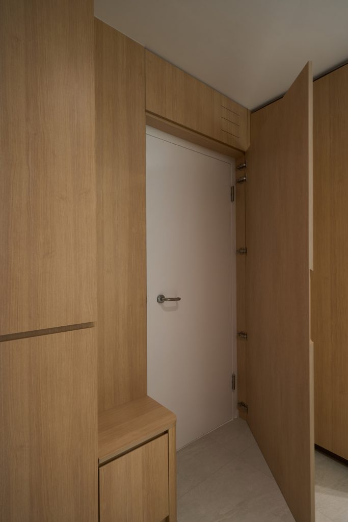 Condo renovation at 45 Canberra Drive Singapore with light oak carpentry and sage green walls by Interior Diary