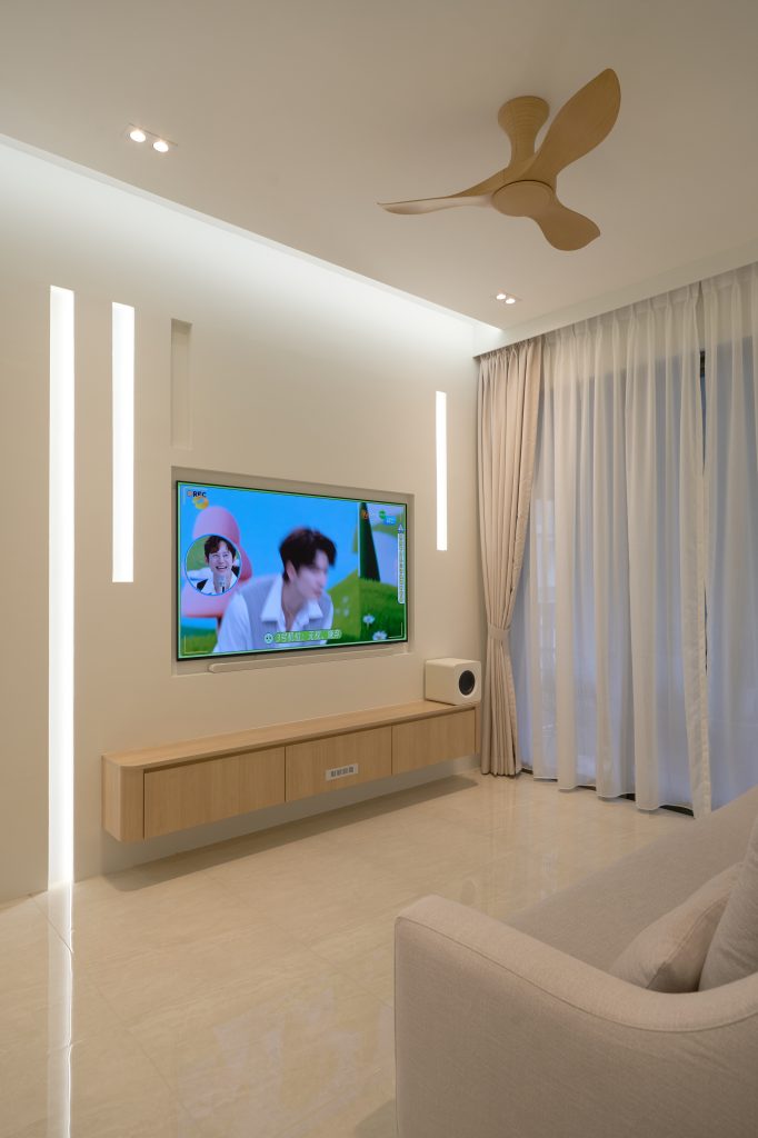 Condo renovation at 45 Canberra Drive Singapore with light oak carpentry and sage green walls by Interior Diary