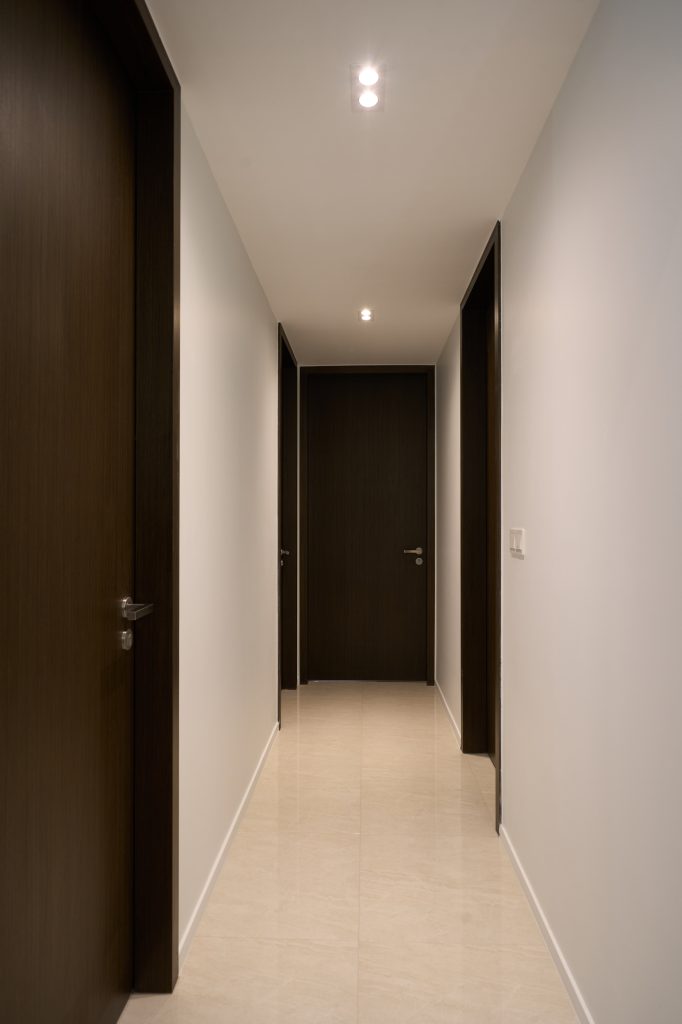 Condo renovation at 45 Canberra Drive Singapore with light oak carpentry and sage green walls by Interior Diary