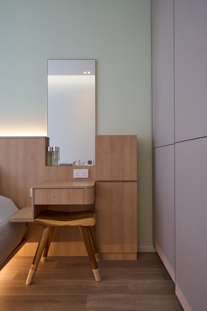 Condo renovation at 45 Canberra Drive Singapore with light oak carpentry and sage green walls by Interior Diary